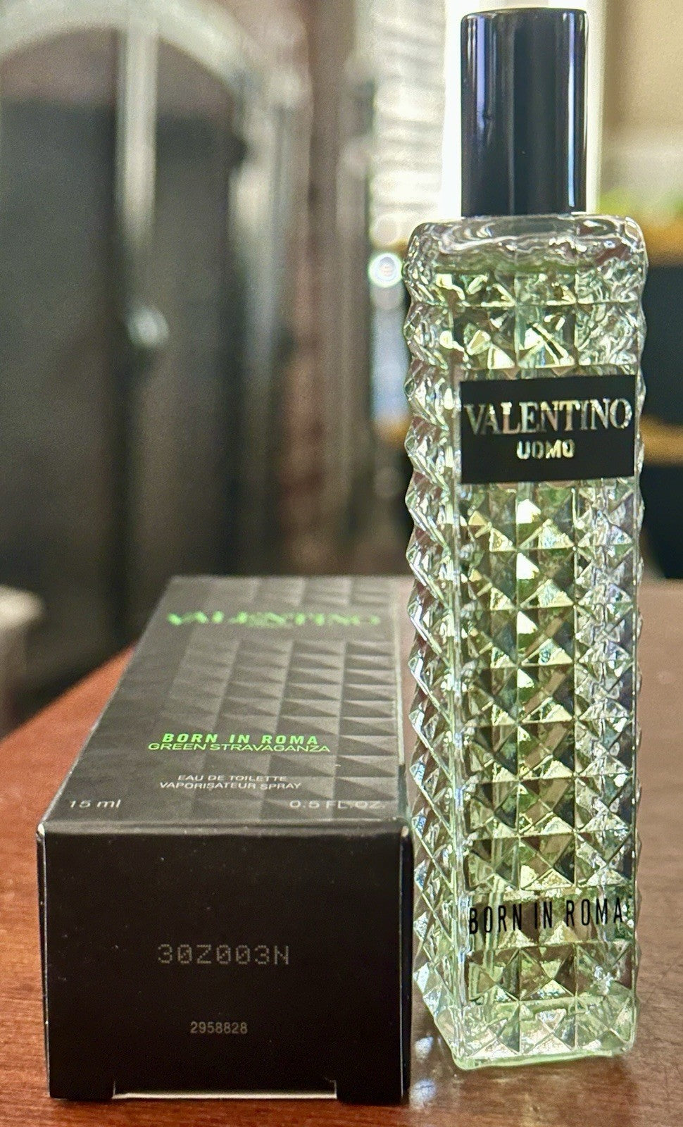 Valentino Uomo Born in Roma Green Stravaganza bottle beside box